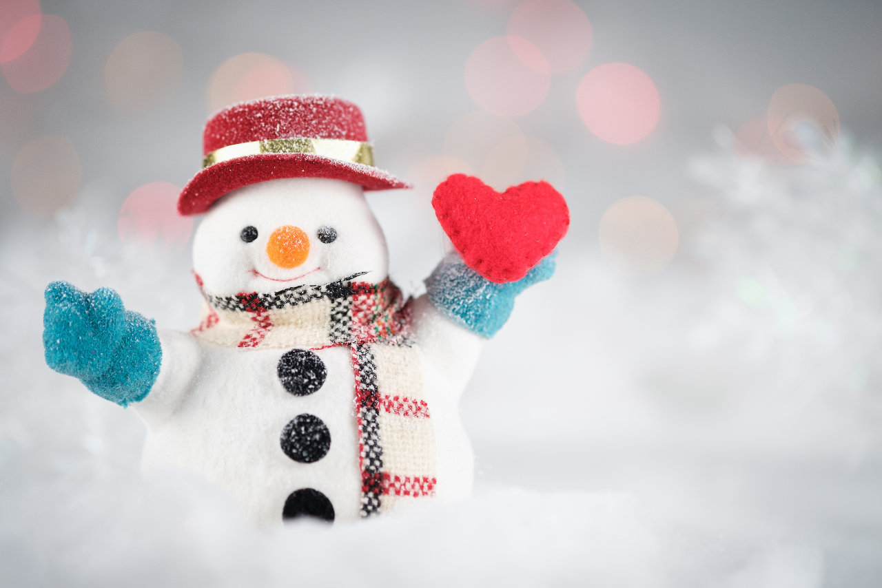 Snowman holding a heart